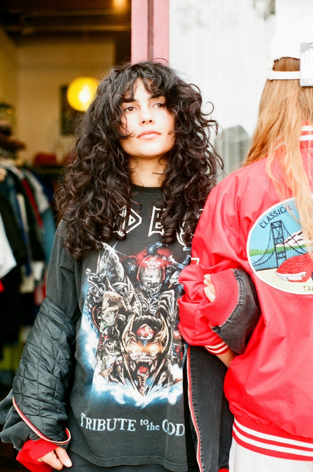 a woman standing next to a man in a red jacket